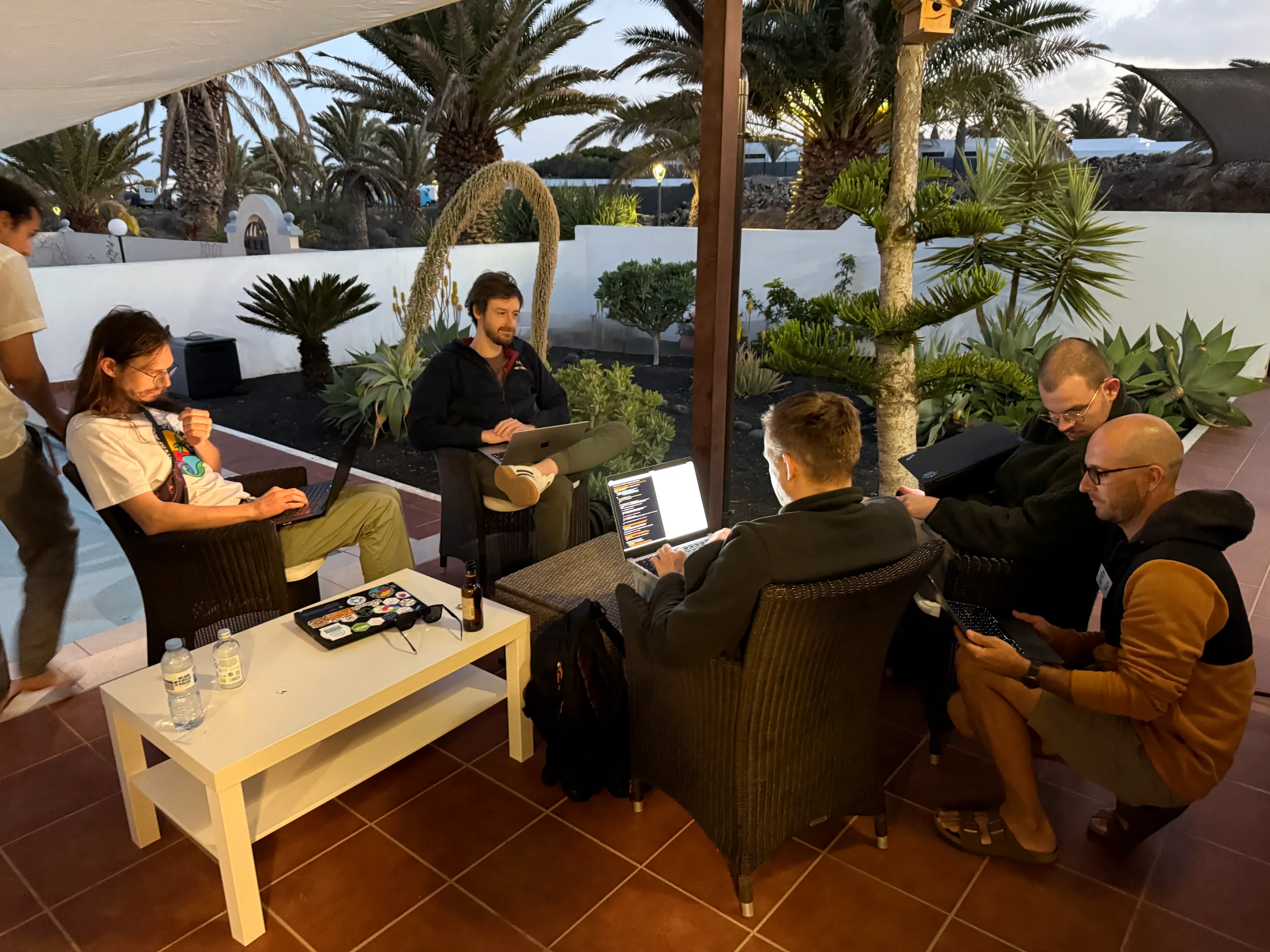 People hacking on the deck of Niteo House